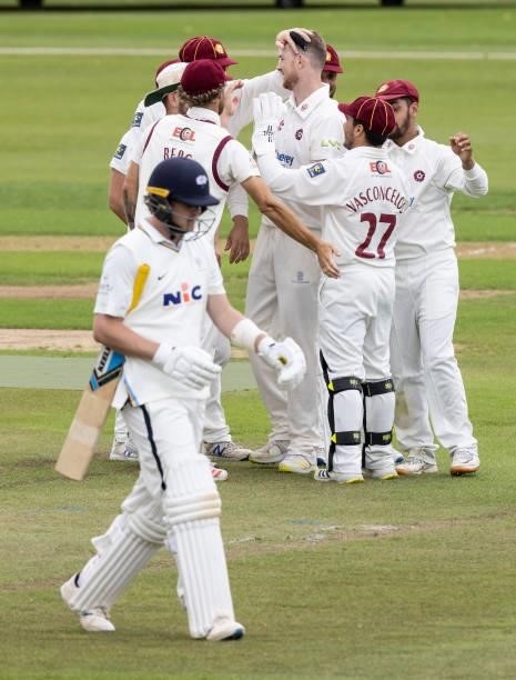 Tom Taylor of Northamptonshire celebrates with his team mates after taking the wicket of Sam Northeast of Yorkshire during day one of the LV=...
