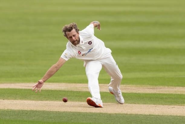 Gareth Berg of Northamptonshire fields off of his own bowling during day one of the LV= Insurance County Championship match between Northamptonshire...