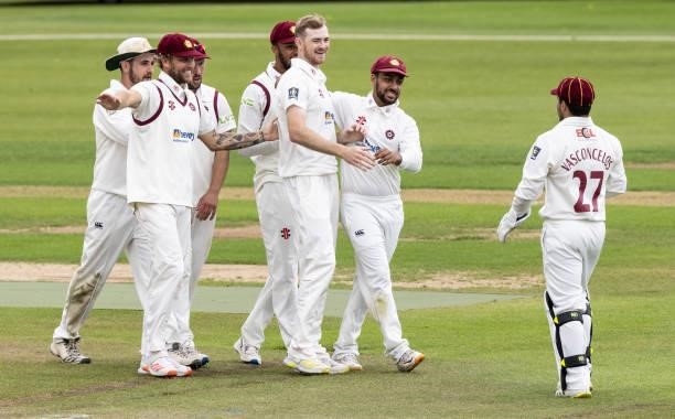 Tom Taylor of Northamptonshire celebrates with his team mates after taking the wicket of Sam Northeast of Yorkshire during day one of the LV=...