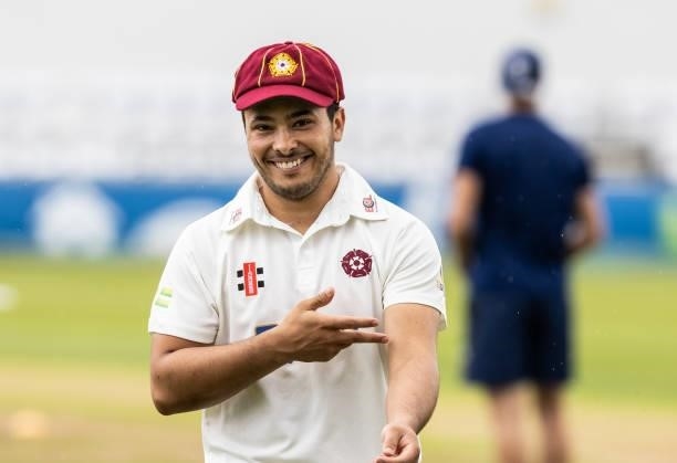 Ricardo Vasconcelos of Northamptonshire returns to his team mates after losing the toss during day one of the LV= Insurance County Championship match...