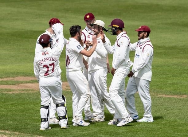 Charlie Thurston of Northamptonshire celebrates taking a catch to dismiss Gary Ballance of Yorkshire during day one of the LV= Insurance County...