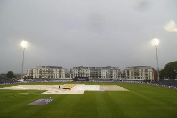 Groundstaff adjust the covers as rain falls during the third one-day international between England and Sri Lanka at Bristol County Ground in...