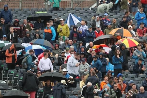 Spectators shelter under umbrellas form the rain during the interval of the third one-day international between England and Sri Lanka at Bristol...