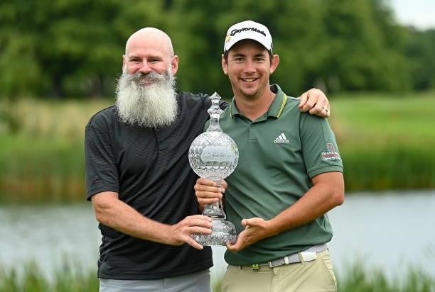 Kilkenny , Ireland - 4 July 2021; Lucas Herbert of Australia and his caddie Nick Pugh, left, with the trophy after winning the Dubai Duty Free Irish...