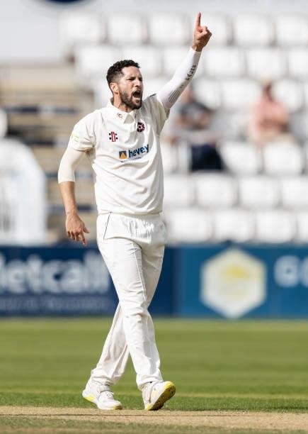 Wayne Parnell of Northamptonshire celebrates with his team mates after taking the wicket of Jordan Thompson of Yorkshire during day one of the LV=...