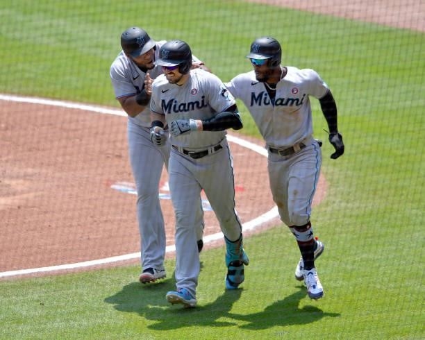 Jesús Aguilar, Adam Duvall, and Starling Marte of the Miami Marlins celebrate after Duvall's three run homer in the sixth inning against the Atlanta...