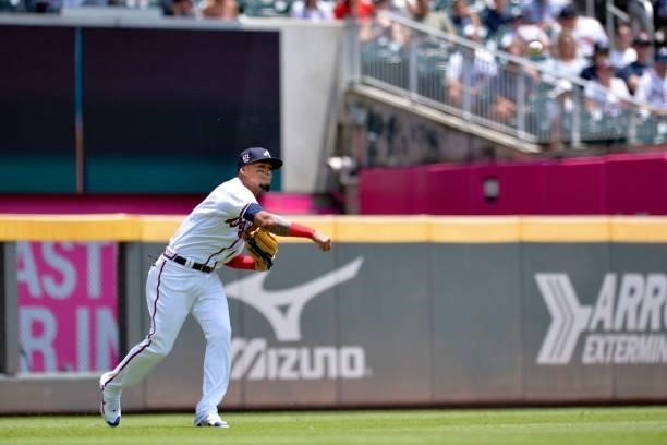 Orlando Arcia of the Atlanta Braves fields a line drive in the fourth inning against the Miami Marlins at Truist Park on July 4, 2021 in Atlanta,...