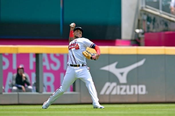 Orlando Arcia of the Atlanta Braves fields a line drive in the fourth inning against the Miami Marlins at Truist Park on July 4, 2021 in Atlanta,...