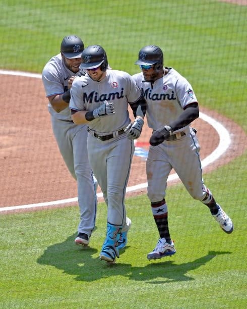 Jesús Aguilar, Adam Duvall, and Starling Marte of the Miami Marlins celebrate after Duvall's three run homer in the sixth inning against the Atlanta...