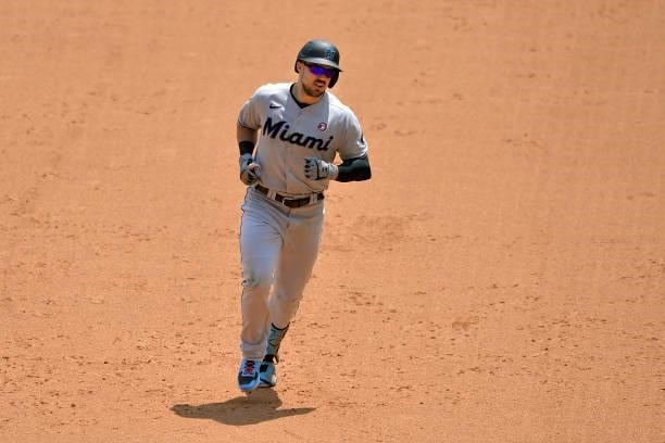 Adam Duvall of the Miami Marlins runs to third base after hitting a three run homer in the sixth inning against the Atlanta Braves at Truist Park on...