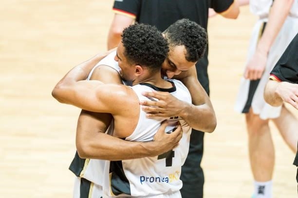 Maodo Lo of Germany reacts with Johannes Thiemann of Germany after winning the 2020 FIBA Men's Olympic Qualifying Tournament final between Germany...