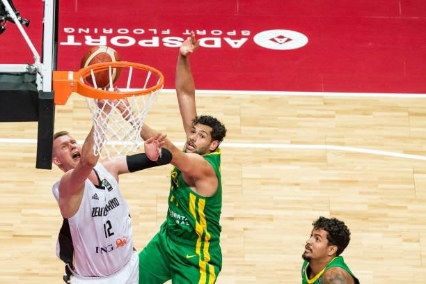 Robin Benzing of Germany making a layup against Leonardo Meindl of Brazil during the 2020 FIBA Men's Olympic Qualifying Tournament final between...