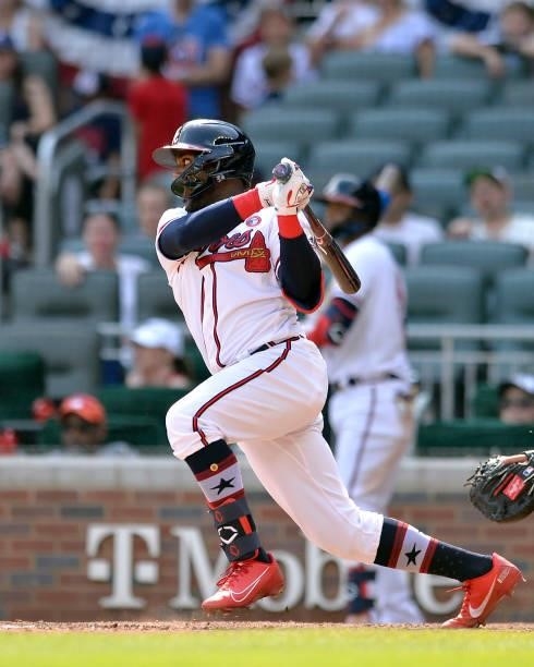 Guillermo Heredia of the Atlanta Braves makes a base hit in the ninth inning against the Miami Marlins at Truist Park on July 4, 2021 in Atlanta,...