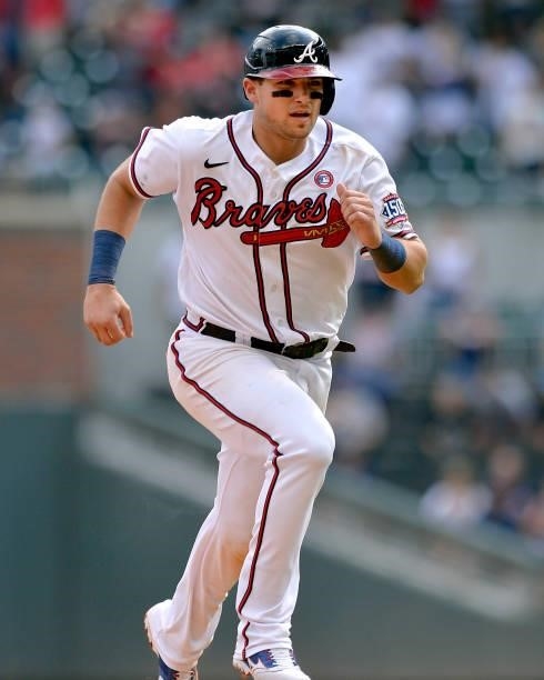 Austin Riley of the Atlanta Braves runs to third base in the tenth inning against the Miami Marlins at Truist Park on July 4, 2021 in Atlanta,...