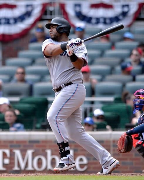 Jesús Aguilar of the Miami Marlins hits a base hit in the eighth inning against the Atlanta Braves at Truist Park on July 4, 2021 in Atlanta, Georgia.