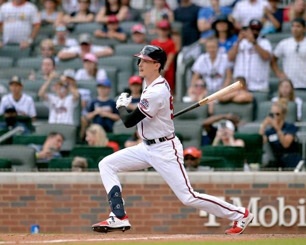 Max Fried of the Atlanta Braves hits a single to score the winning run in the tenth inning against the Miami Marlins at Truist Park on July 4, 2021...