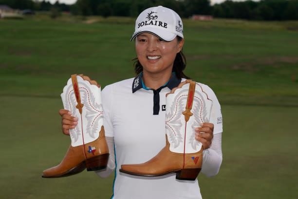 Jin Young Ko of Korea poses with cowboy boots after winning the Volunteers of America Classic at the Old American Golf Club on July 4, 2021 in The...