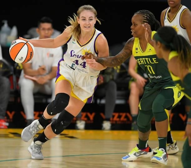 Karlie Samuelson of the Los Angeles Sparks drives the lane against Epiphanny Prince of the Seattle Storm in the first half at Los Angeles Convention...