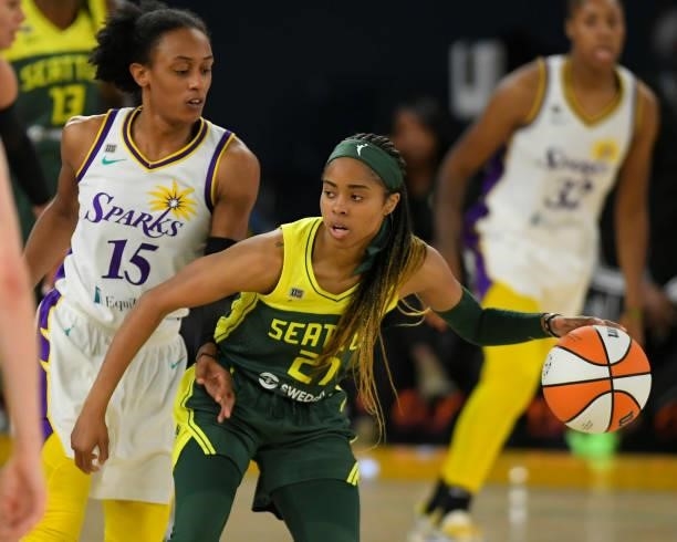 Brittney Sykes of the Los Angeles Sparks guards Jordin Canada of the Seattle Storm in the first half at Los Angeles Convention Center on July 4, 2021...