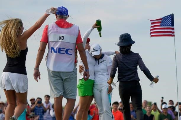 Jin Young Ko of Korea, second from right, is doused by fellow player Gaby Lopez of Mexico, center, after winning the Volunteers of America Classic at...