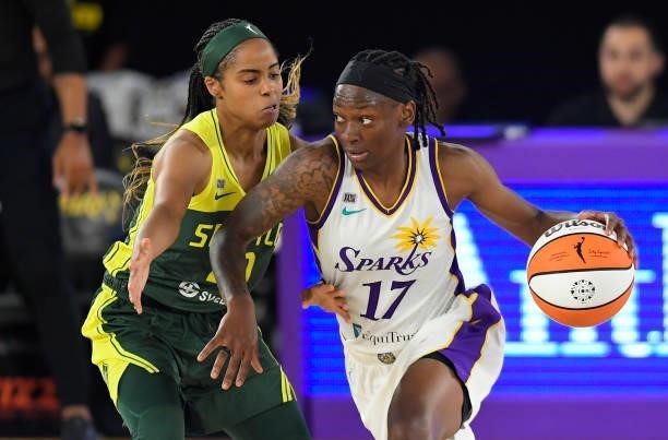 Jordin Canada of the Seattle Storm guards Erica Wheeler of the Los Angeles Sparks at the Los Angeles Convention Center on July 4, 2021 in Los...