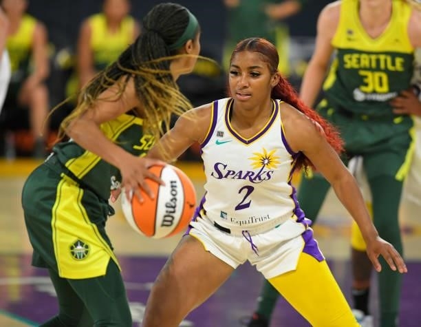 Tea Cooper of the Los Angeles Sparks guards Jordin Canada of the Seattle Storm at the Los Angeles Convention Center on July 4, 2021 in Los Angeles,...
