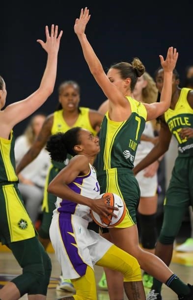 Brittney Sykes of the Los Angeles Sparks is found by Stephanie Talbot of the Seattle Storm in the first half at the Los Angeles Convention Center on...