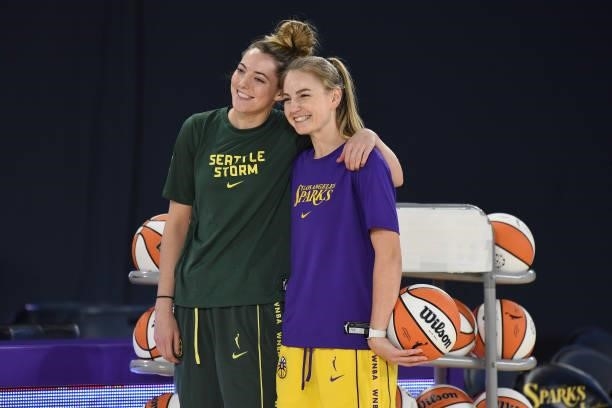 Katie Lou Samuelson of the Seattle Storm and Karlie Samuelson of the Los Angeles Sparks take a picture together before the game on July 4, 2021 at...
