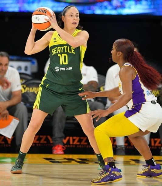 Sue Bird of the Seattle Storm looks to pass the ball over Tea Cooper of the Los Angeles Sparks at the Los Angeles Convention Center on July 4, 2021...