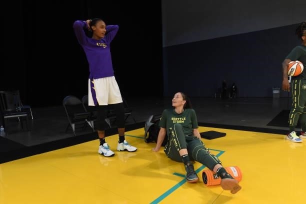 Brittney Sykes of the Los Angeles Sparks talks with Sue Bird of the Seattle Storm before the game on July 4, 2021 at Los Angeles Convention Center in...