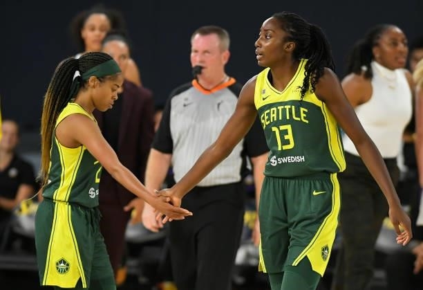 Jordin Canada and Ezi Magbegor of the Seattle Storm congratulate each other in the fourth quarter while playing the Los Angeles Sparks at the Los...