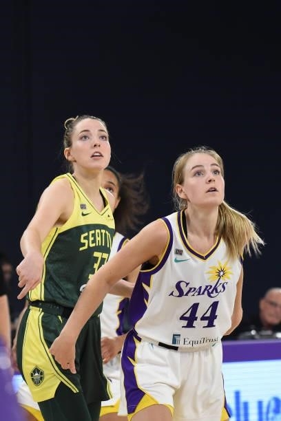 Katie Lou Samuelson of the Seattle Storm and Karlie Samuelson of the Los Angeles Sparks look on during the game on July 4, 2021 at Los Angeles...