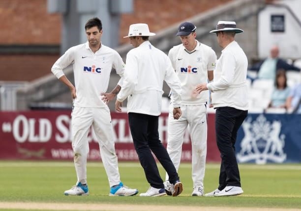 Umpires Billy Taylor and Tom Lungley speak with Yorkshire captain Steven Patterson and bowler Duanne Olivier after the latters reaction to a not out...
