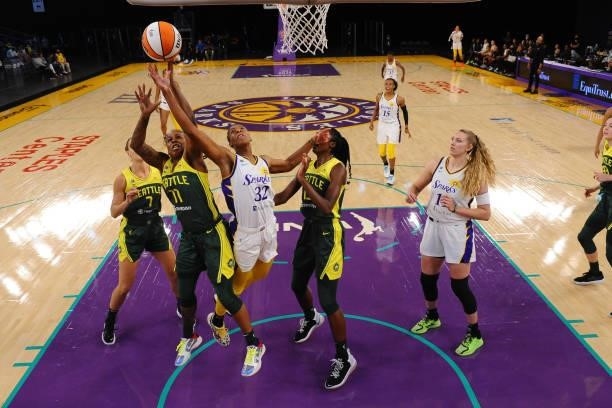 Epiphanny Prince of the Seattle Storm and Bria Holmes of the Los Angeles Sparks reach for the ball during the game on July 4, 2021 at Los Angeles...