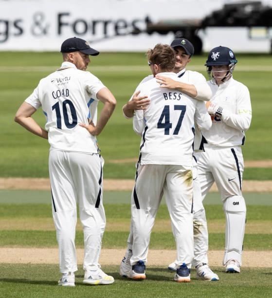 Dominic Bess of Yorkshire celebrates with his team mates after taking the wicket of Wayne Parnell of Northamptonshire , his sixth wicket of the...