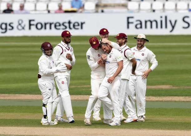 Simon Kerrigan of Northamptonshire celebrates with team mates after taking the wicket of George Hill of Yorkshire during day two of the LV= Insurance...
