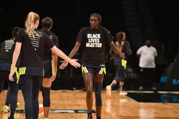 Awak Kuier of the Dallas Wings high fives teammate Bella Alarie before the game against the New York Liberty on July 5, 2021 at the Barclays Center...