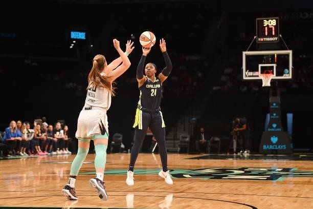 Arike Ogunbowale of the Dallas Wings shoots the ball over Sabrina Ionescu of the New York Liberty on July 5, 2021 at the Barclays Center in Brooklyn,...