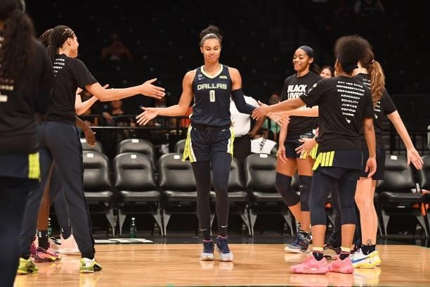 Satou Sabally of the Dallas Wings high fives teammates before the game against the New York Liberty on July 5, 2021 at the Barclays Center in...