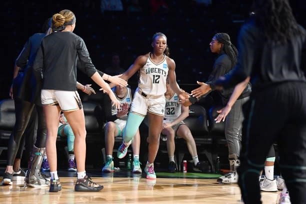 Michaela Onyenwere of the New York Liberty high fives teammates before the game against the Dallas Wings on July 5, 2021 at the Barclays Center in...