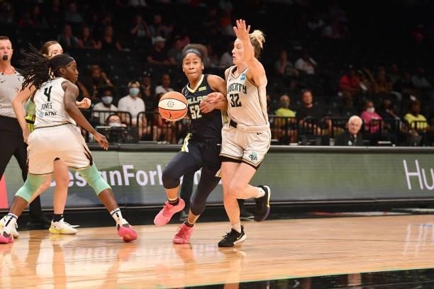 Sami Whitcomb of the New York Liberty plays defense on Tyasha Harris of the Dallas Wings on July 5, 2021 at the Barclays Center in Brooklyn, New...