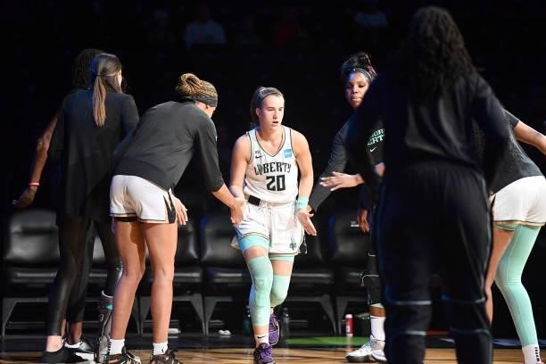 Sabrina Ionescu of the New York Liberty high fives teammates before the game against the Dallas Wings on July 5, 2021 at the Barclays Center in...