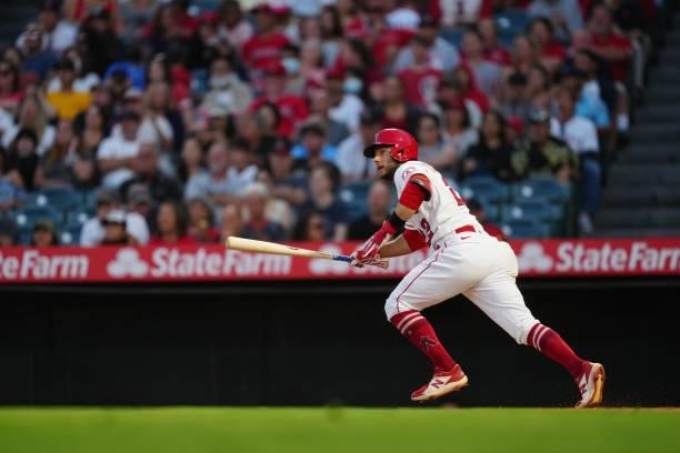 David Fletcher of the Los Angeles Angels runs to first base as he extends his hitting streak to 19 during the game between the Boston Red Sox and the...