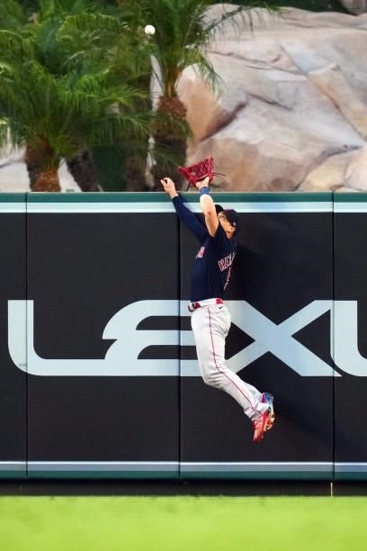 Enrique Hernández of the Boston Red Sox jumps to make a catch during the game between the Boston Red Sox and the Los Angeles Angels at Angel Stadium...