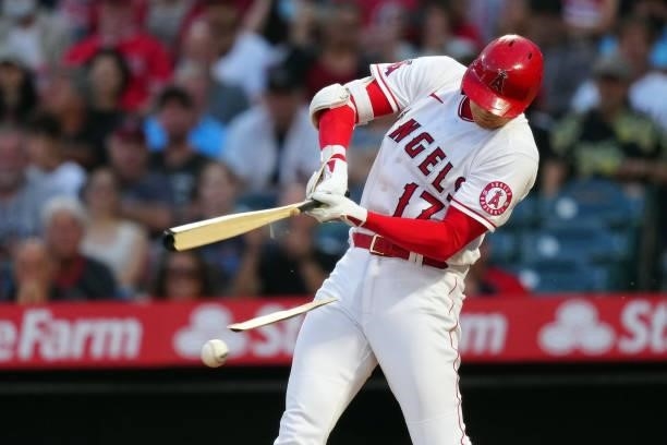 Shohei Ohtani of the Los Angeles Angels breaks his bat during the game between the Boston Red Sox and the Los Angeles Angels at Angel Stadium on...