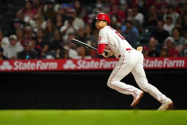 Shohei Ohtani of the Los Angeles Angels singles during the game between the Boston Red Sox and the Los Angeles Angels at Angel Stadium on Monday,...