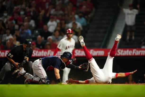 Christian Vázquez of the Boston Red Sox tags out Jose Rojas of the Los Angeles Angels at the plate during the game between the Boston Red Sox and the...