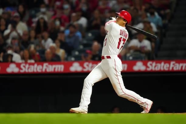 Shohei Ohtani of the Los Angeles Angels singles during the game between the Boston Red Sox and the Los Angeles Angels at Angel Stadium on Monday,...