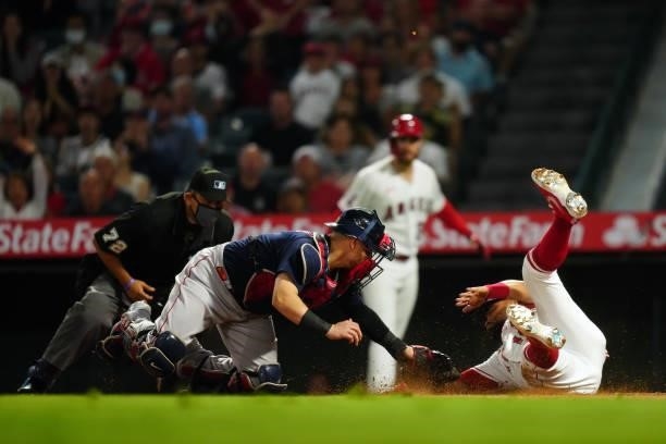 Christian Vázquez of the Boston Red Sox tags out Jose Rojas of the Los Angeles Angels at the plate during the game between the Boston Red Sox and the...