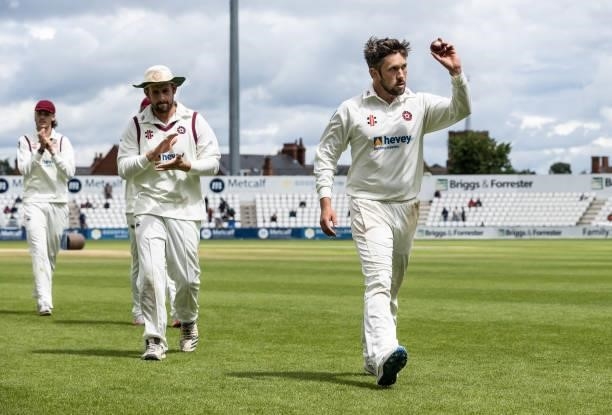 Simon Kerrigan of Northamptonshire leaves the field at the end of the Yorkshire innings having taken five wickets for thirty nine runs during day...